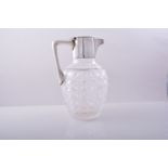 A cut-glass and silver-mounted claret jug, by Hukin & Heath Ltd.