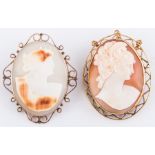 Two brooches,  both oval carved shell cameos of female profiles in yellow metal wire work frames.