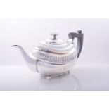 A Regency silver oval teapot, Samuel Hennell, London 1816, gadrooned outline, with moulded bands,