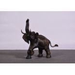 An Indian cast bronze patinated model of an elephant, 74cm.