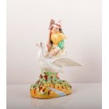 A Staffordshire figure of a witch on a goose, 19th Century, painted in colours, 19cms.