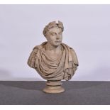 A marble portrait bust, of a gentleman in Roman attire, with a laurel wreath,