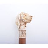 A stained beechwood walking cane, carved resin pommel designed as the head of a retriever,