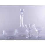 A suite of table glassware, star-cut engraved decoration, comprising a pair of wine decanters,