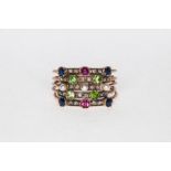 A five band multi stone ring, set with raised sapphires, rubies,