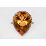 A citrine and diamond pear shaped cluster ring, the pear shaped citrine measuring 20mm by 15mm,