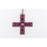A white metal cross set with oval cabochon cut untested synthetic pink stones (8) with a large