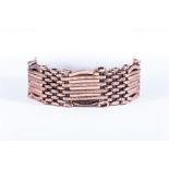 A hallmarked 9 carat rose gold 9 bar gate link design bracelet,