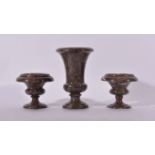 A garniture of three mottled brown marble campana urns, the tallest 34cms, the smaller pair 20cms,