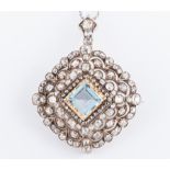 An aquamarine and diamond lozenge shaped brooch/pendant ,