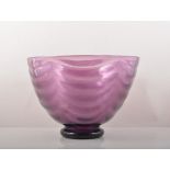 An amethyst tinted festooned glass bowl, possibly designed by Gordon Russell, rounded funnel form,