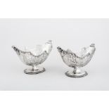 A pair of Edwardian silver boat-shaped pedestal dessert bowls, by Josiah Williams & Co.