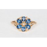 A sapphire and diamond circular floral cluster ring,