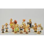 Collection of fifteen Goebel Hummel, to included boy carrying fish, girl and geese,