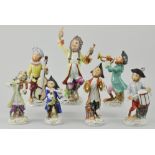 Modern Continental seven piece monkey band, to include conductor, drummer, violinist, flutist,