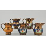 Collection of five copper lustre jugs, 12cm and smaller, a Staffordshire comport and plates.