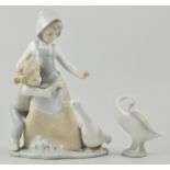 Lladro group  of a girl, boy and goose, 26cm, and another Lladro figure of a goose, (2).