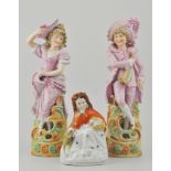 Pair of Austrian biscuit porcelain figures, together with a Staffordshire figure of Red Riding Hood,