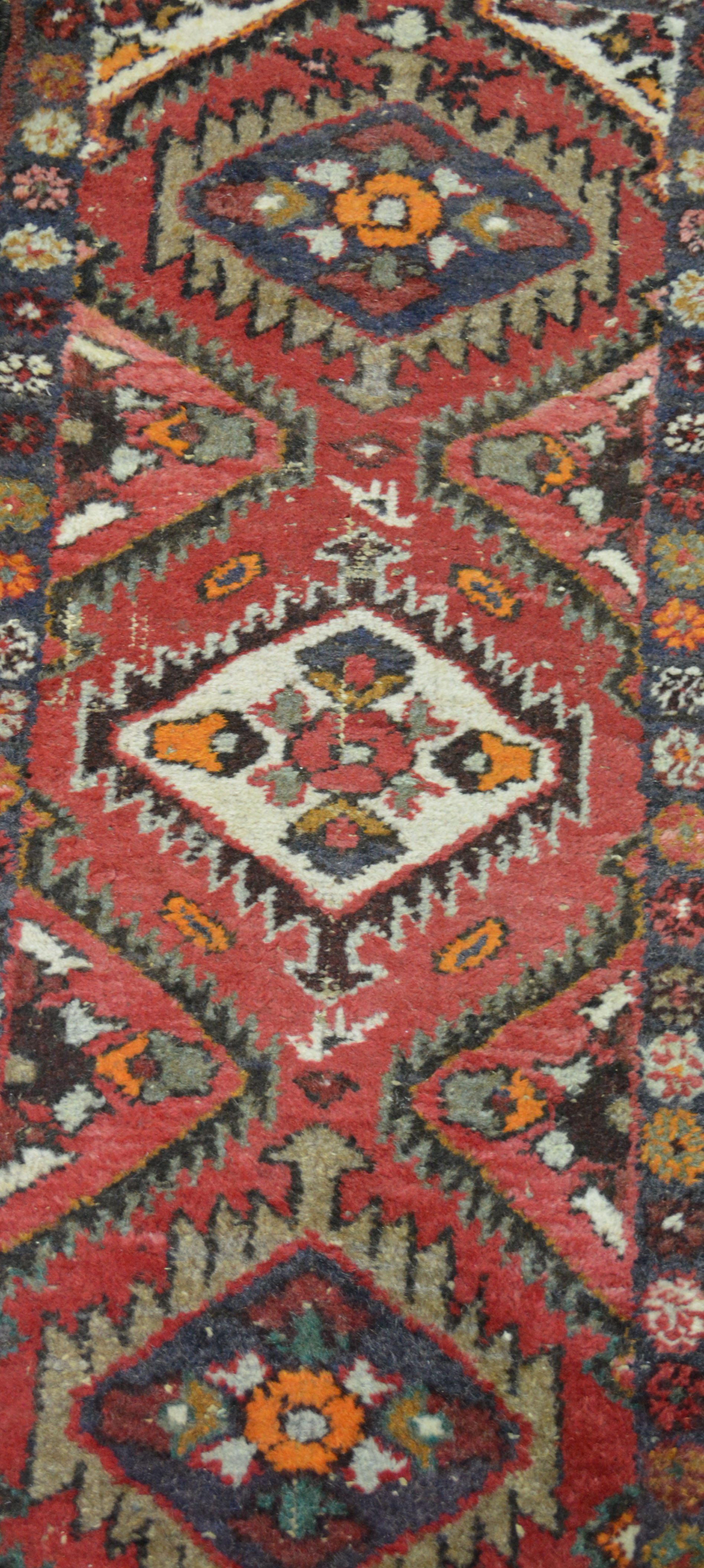 Hamadan rug, central medallion, red ground, 90cm x 62cm and two other rugs, (3).