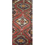 Hamadan rug, central medallion, red ground, 90cm x 62cm and two other rugs, (3).