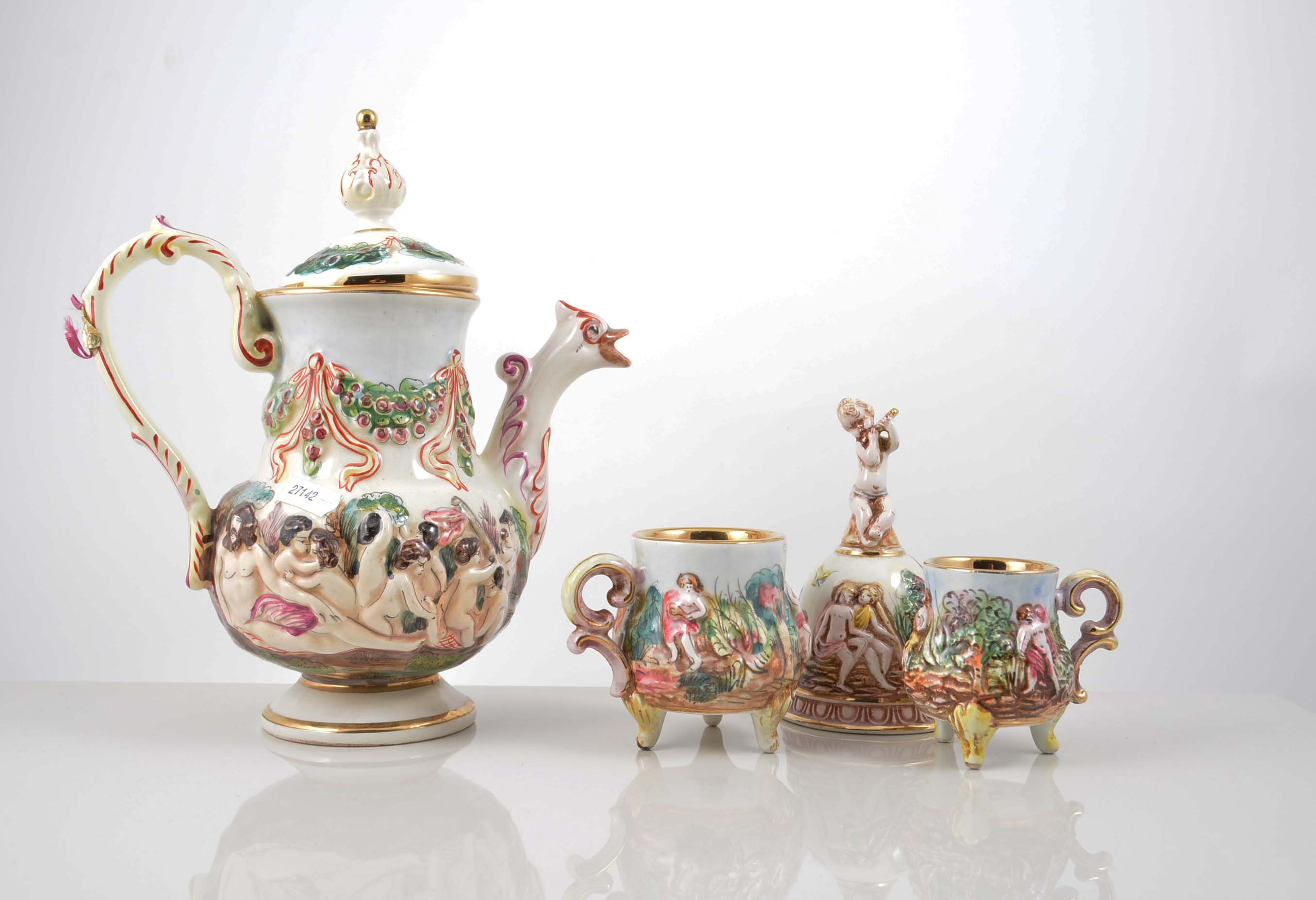 Capodimonte pottery coffee set, moulded and painted decoration of frolicking cherubs,