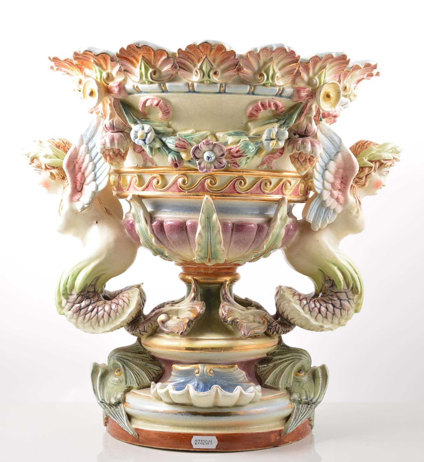 Continental pottery campana shaped urn, moulded decoration of floral swags, with winged mermaids,