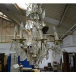 White metal moulded glass eight branch chandelier, twelve candle fitments, faceted pendants,