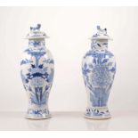 Pair of Chinese blue and white baluster shape vases, floral decoration with domed lids, 27cm,