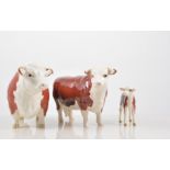 Beswick, "Champion of Champions", a Hereford Bull, Cow and calf, all gloss,