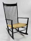 Hans Wegner. An ebonised J16 rocking chair, for F.D.B. Mobler, with paper cord seat, stamped marks
