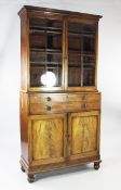 A George III mahogany secretaire bookcase, with ebony line inlaid decoration, fitted a pair of