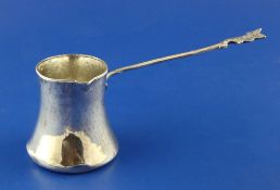 A late 19th/early 20th century Turkish silver pouring vessel, of tapering form with elongated handle