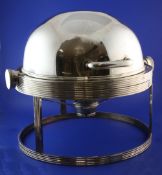 A French Art Deco Orfevrerie electroplate warming meat dish with revolving cover on reeded stand and