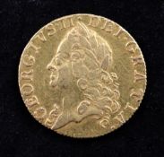 A George II 1754 gold guinea, (F).