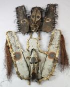 A Papua New Guinea Sepik River canoe shield, of rattan and palm leaf construction, polychrome