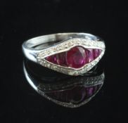 A white gold, ruby and diamond elliptical shaped ring, the central oval cut ruby flanked by six