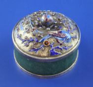 A 20th century Chinese silver and enamel mounted green hardstone circular box and cover, the lid
