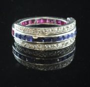 A white gold triple band ruby, sapphire and diamond eternity ring, with two swivelling diamond set