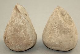 A pair of Greek stone loom weights, c.3rd century BC, each of pear shape, 8.5cm and 9.5cm