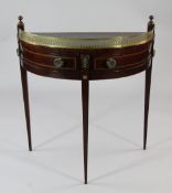 A 19th century mahogany demi lune side table, the top with pierced brass gallery over two swing