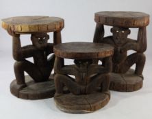 Papua New Guinea Sepik River, three similar low hardwood tables, each carved from a single section