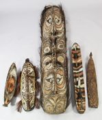 A Papua New Guinea Sepik River large carved wooden shield, with double mask, polychrome decoration