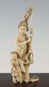 A Japanese ivory group of a woman carrying a basket of pomegranates, Meiji period, a child with