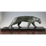 Mathias Gonzales. An Art Deco patinated bronze model of a panther, on a rectangular polished