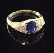 An early 20th century 18ct gold, sapphire and diamond elliptical shaped ring, with carved setting,