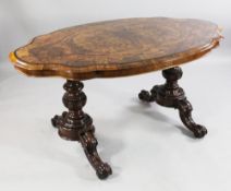 A Victorian burr walnut serpentine shape centre table, with ebony crossbanded top, with fluted and