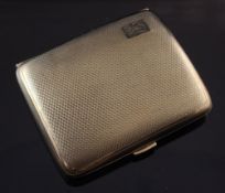 A George V engine turned 9ct gold cigarette case, of concave form, with engraved monogram,