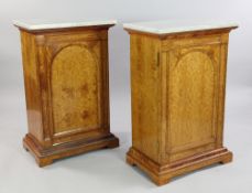 Royal Furniture: A pair of Victorian marble top satinwood cabinets, ex-Frogmore House, each with a