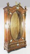 A large 19th century French Louis XVI style display cabinet, with ormolu mounts and blue ground oval