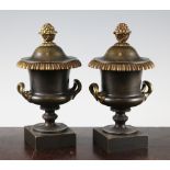 A pair of early 20th century French bronze cassolettes, of campana urn form, the reversible lids